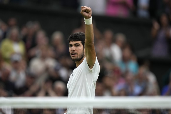 Spain&#039;s Carlos Alcaraz celebrates after beating Russia&#039;s Daniil Medvedev to win their men&#039;s singles semifinal match on day twelve of the Wimbledon tennis championships in London, Friday ...