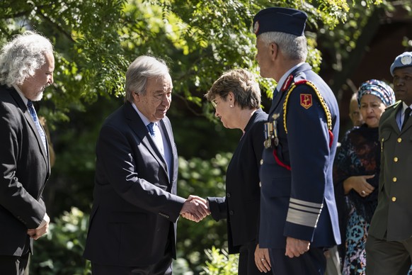epa10652944 UN Secretary General Antonio Guterres (L) greets Swiss Federal Councillor and Defense minister Viola Amherd (C) ahead of a ceremony in honor of all UN Peacekeepers, Blue Helmets, who have  ...