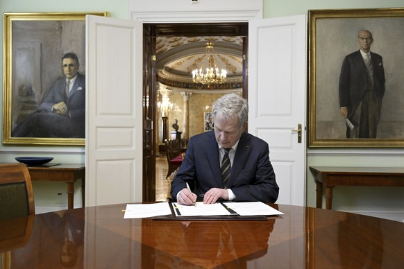 Finland&#039;s President Sauli Niinisto signs Finland&#039;s national Nato legislation in Helsinki, Finland, Thursday March 23, 2023. The Finnish president has sealed the Nordic country?s historic bid ...