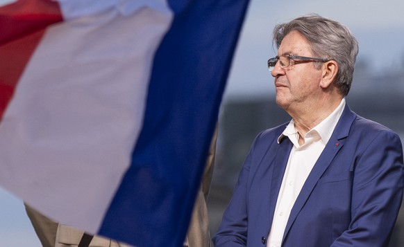 epa11465989 Leader of La France Insoumise (LFI), Jean-Luc Melenchon speaks listens to a speech after the announcement of the results of the second round of the legislative elections in Paris, France,  ...