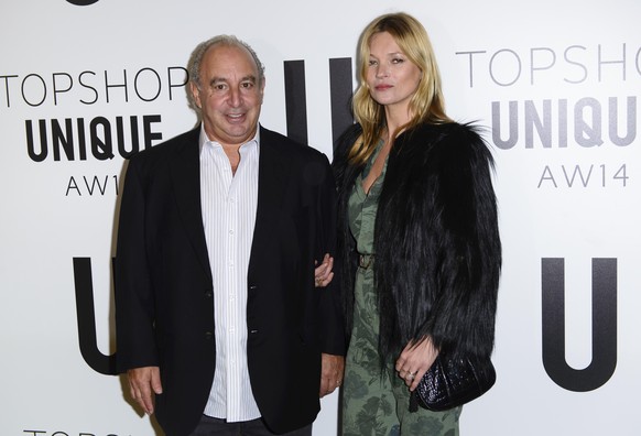 British businessman Sir Philip Green and British model Kate Moss attend the Topshop Unique collection during London Fashion Week Autumn/Winter 2014, at the Tate Modern in central London, Sunday, Feb.  ...