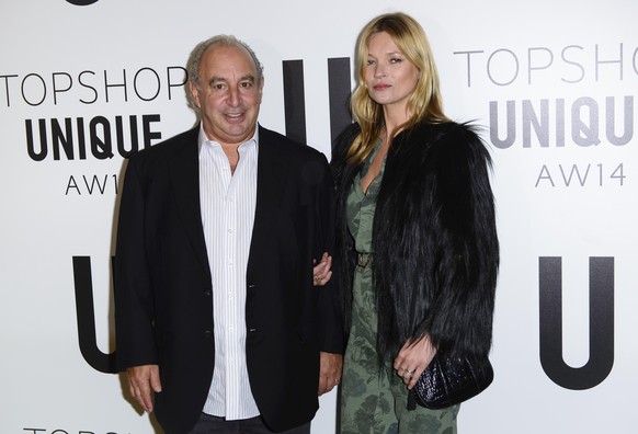 British businessman Sir Philip Green and British model Kate Moss attend the Topshop Unique collection during London Fashion Week Autumn/Winter 2014, at the Tate Modern in central London, Sunday, Feb.  ...