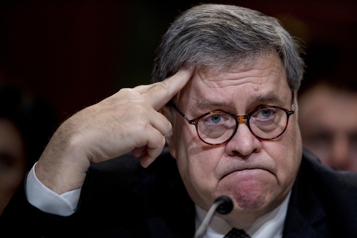 FILE - In this Wednesday, April 10, 2019, file photo, U.S. Attorney General William Barr reacts as he appears before a Senate Appropriations subcommittee to make his Justice Department budget request  ...