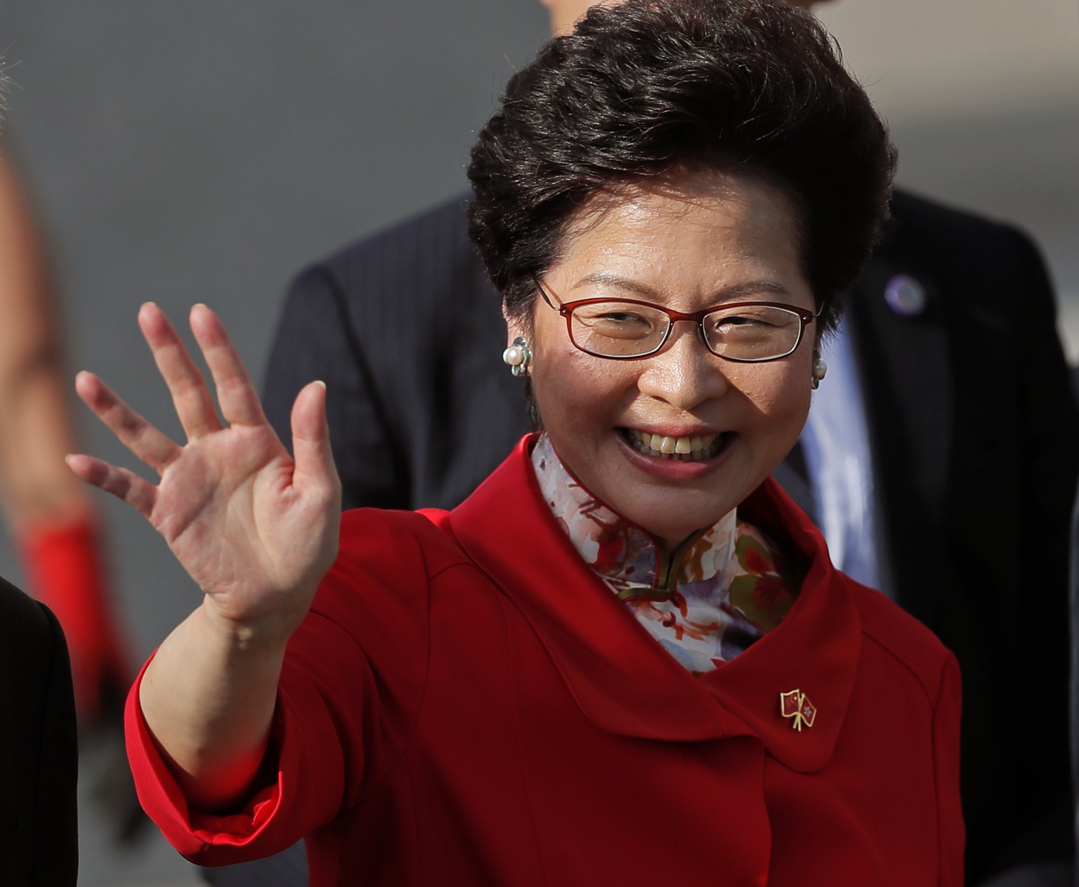 Hong Kong Chief Executive-elect Carrie Lam waves to guests before attending the flag raising ceremony to mark the 20th anniversary of the Hong Kong handover to China in Hong Kong, Saturday, July 1, 20 ...