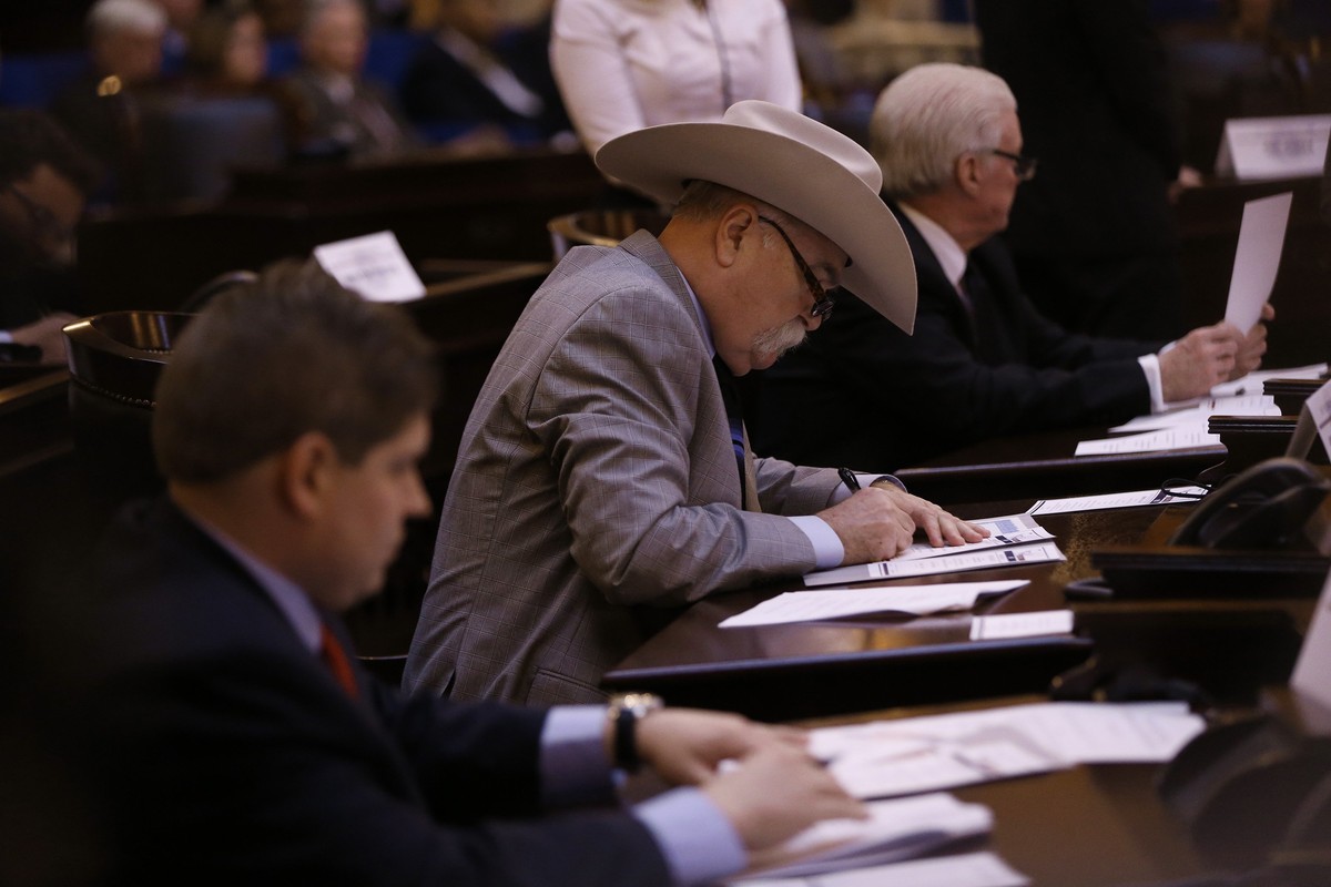 Electoral College member Richard Jones signs his ballot in Columbus, Ohio, Monday, Dec. 19, 2016. All 18 of Ohio's Electoral College members voted Monday for Republican Donald Trump despite oppos ...