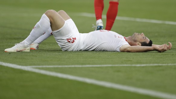 Switzerland&#039;s Blerim Dzemaili lies on the ground during the group E match between Switzerland and Serbia at the 2018 soccer World Cup in the Kaliningrad Stadium in Kaliningrad, Russia, Friday, Ju ...