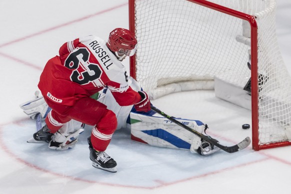 Denmark's Patrick Russell scores the game winning penalty shot against Italy's goaltender Davide Fadani, during the 2026 IIHF Men's Ice Hockey World Championship preliminary round group ...