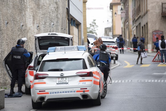 Police are seen in front of the house where a shooting took place, in Grandson on the Lake of Neuchatel, Switzerland, Saturday, February 29, 2020. (KEYSTONE/Laurent Gillieron)