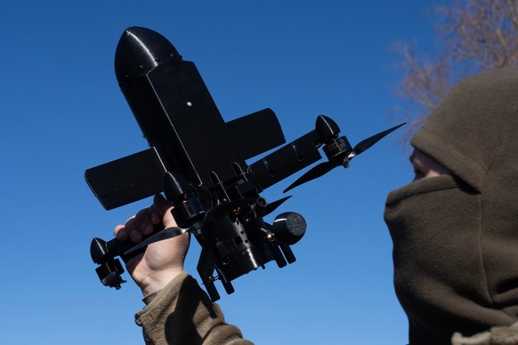 An instructor from the Ukrainian company General Cherry demonstrates the operation of an anti-air interceptor drone designed to destroy Russian attack drones in Kyiv region, Wednesday, March 11, 2026. ...