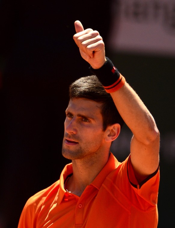 epa04785970 Novak Djokovic of Serbia reacts after winning against Andy Murray of Britain during their semifinal match for the French Open tennis tournament at Roland Garros in Paris, France, 06 June 2 ...