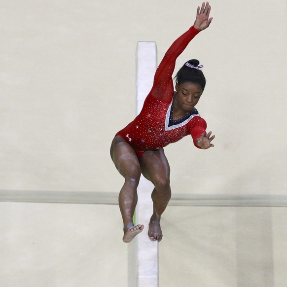 2016 Rio Olympics - Artistic Gymnastics - Final - Women&#039;s Balance Beam Final - Rio Olympic Arena - Rio de Janeiro, Brazil - 15/08/2016. Simone Biles (USA) of USA stumbles during her routine on th ...
