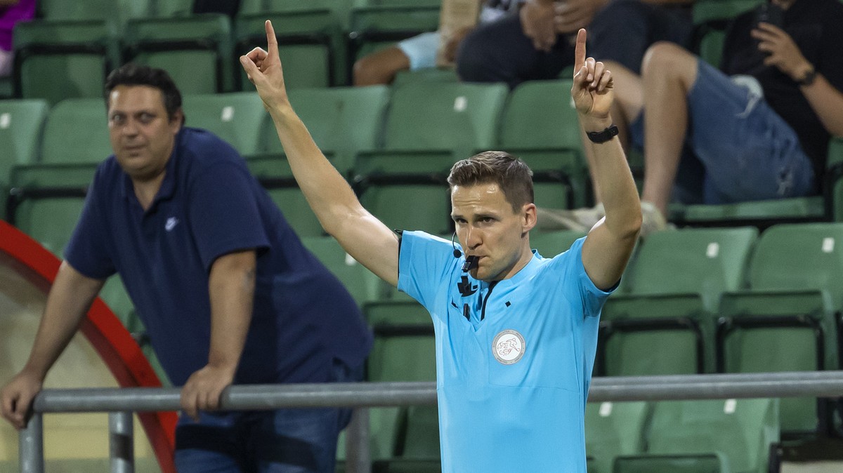 The referee Sven Wolfensberger gestures after checking the VAR screen, during the Super League soccer match of Swiss Championship between FC Sion and FC Servette, at the Stade de Tourbillon stadium, i ...