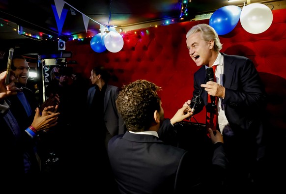 epaselect epa10990065 PVV leader Geert Wilders (R) responds to the results of the House of Representatives elections in Scheveningen, Netherlands, 22 November 2023. Dutch voters headed to the polls on ...