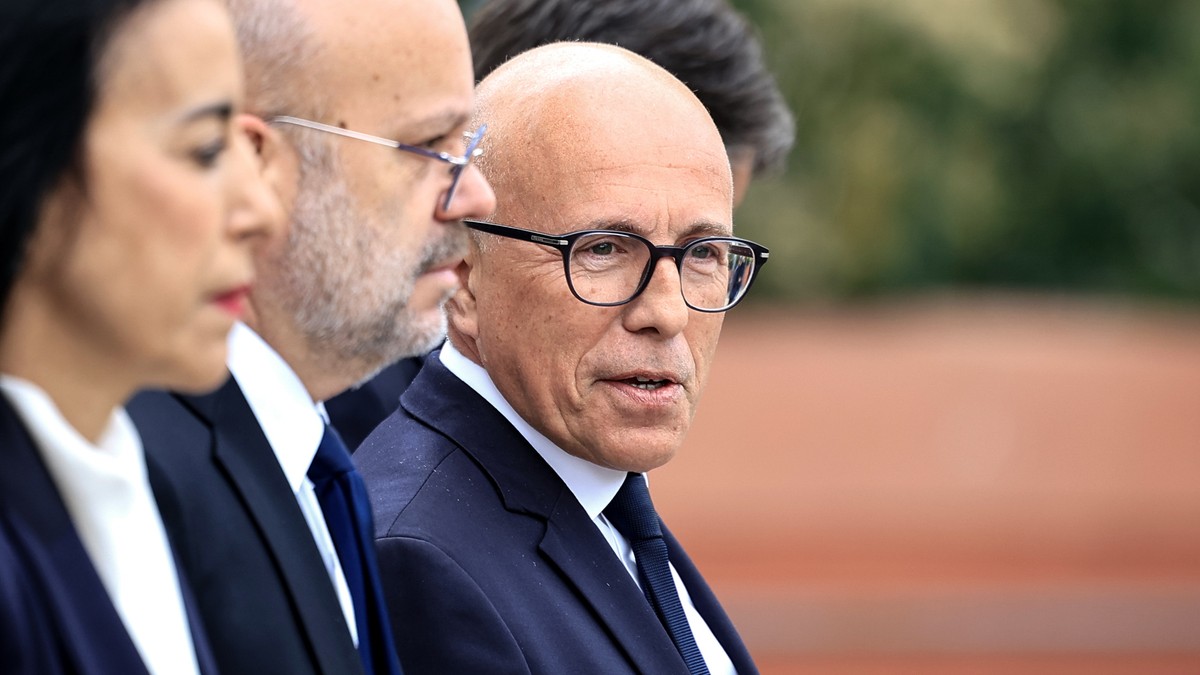 epa11293375 President of the French right-wing party Les Republicains (LR) and MP Eric Ciotti (R) looks on he waits for French prime minister's visit to the Parc Imperial High School to launch an ...