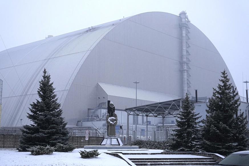A view of the containment vessel that protects the remains of reactor number four at the former Chernobyl nuclear power plant and built to contain radiation, after a drone attack, Ukraine, Friday, Feb ...