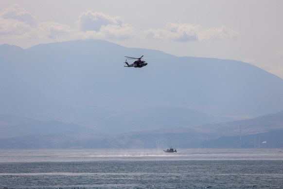 epa11554919 Fire Brigade and Coast Guard units search for missing people who were on board a sailboat that sank in Palermo, Sicily, Italy, 19 August 2024. At least one person died, six remain missing  ...