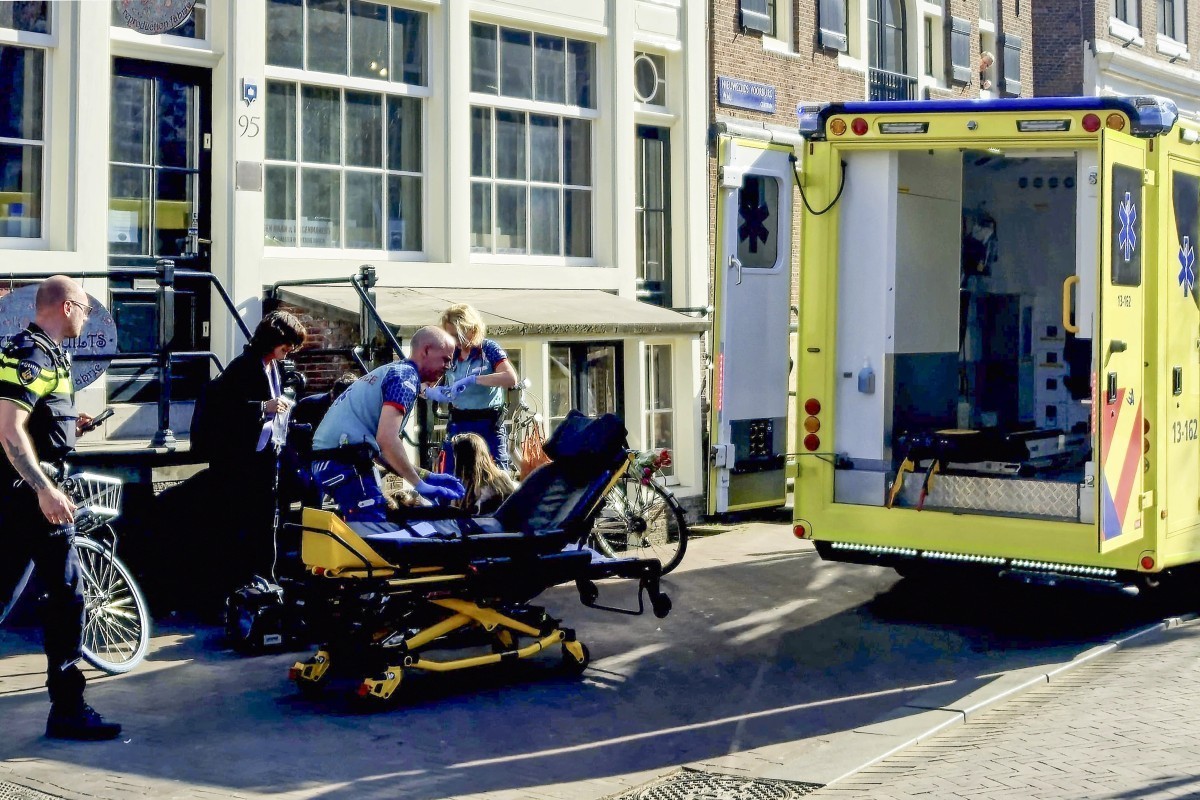 Medical staff assist one of the five person that were wounded during a stabbing attack in Amsterdam on March 27, 2025. A suspect was placed into custody. Police said they had erected a cordon around t ...