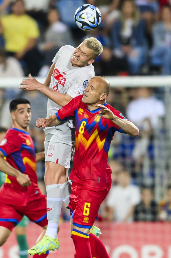 Switzerland&#039;s defender Nico Elvedi, left, fights for the ball with Andorra&#039;s defender Ildefons Lima, right, during the UEFA Euro 2024 qualifying group I soccer match between Andorra and Swit ...