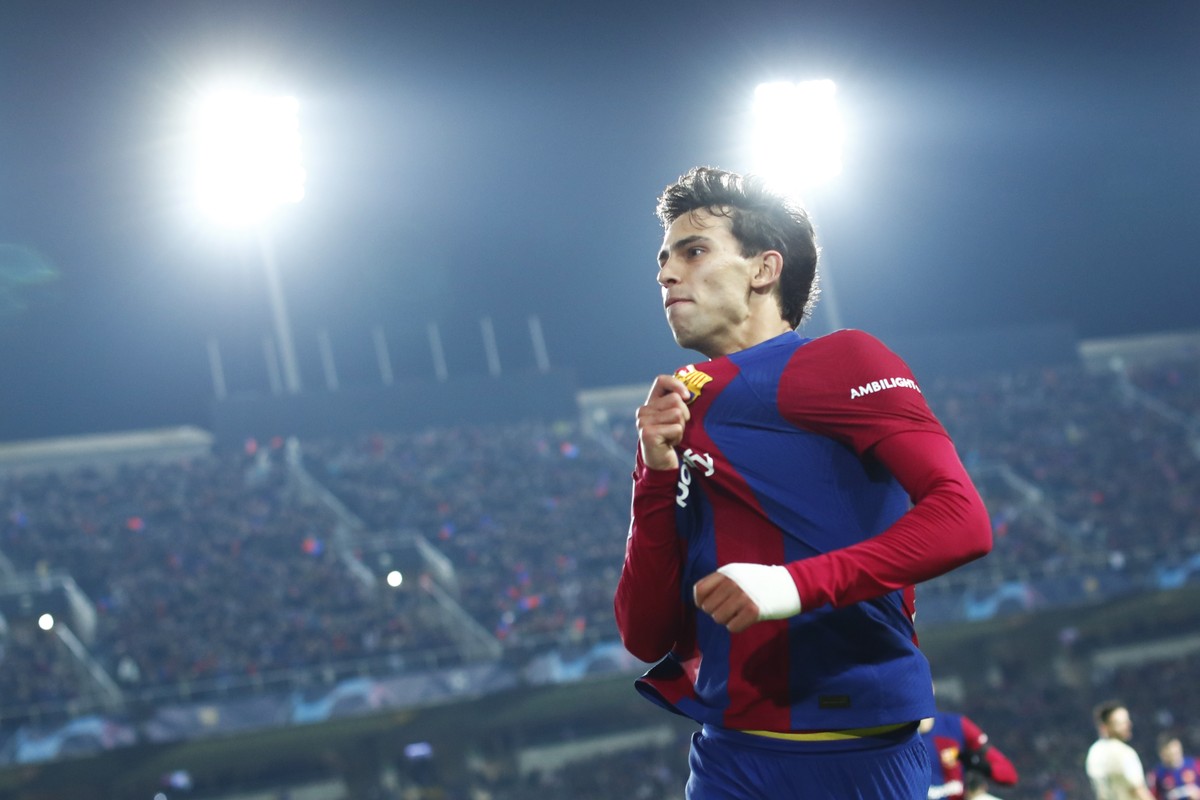 Barcelona's Joao Felix celebrates after scoring his side's second goal during the Champions League Group H soccer match between Barcelona and Porto at the Olympic Stadium in Barcelona, Spain ...