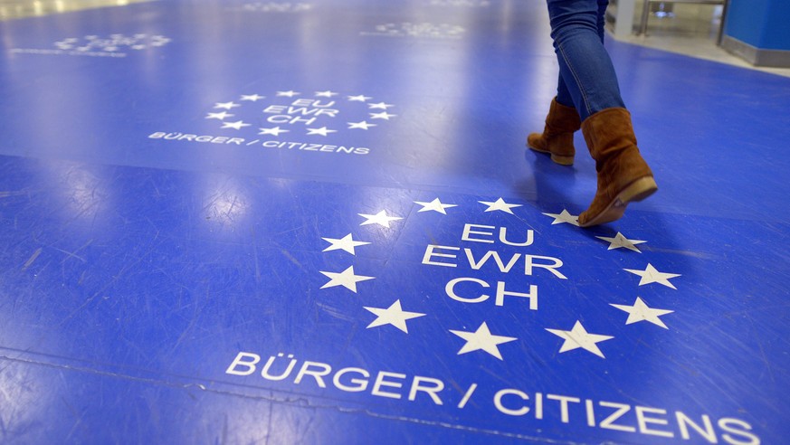 epa04191819 A picture made available on 05 May 2014 shows a woman walking up to the passport control point for citizens of the European Union at Dusseldorf Airport which uses the new automatic easy-pa ...