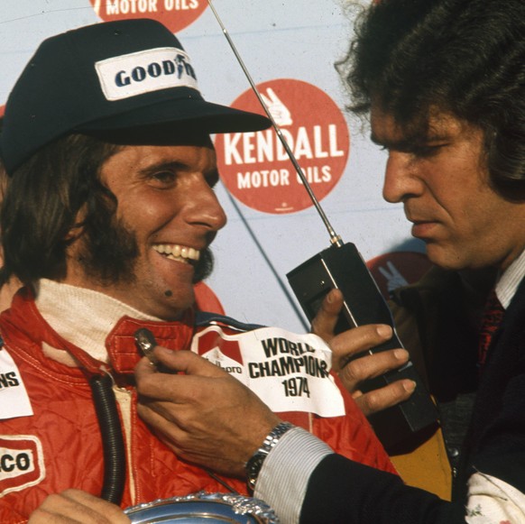 IMAGO / Motorsport Images

1974 United States GP WATKINS GLEN INTERNATIONAL, UNITED STATES OF AMERICA - OCTOBER 06: Emerson Fittipaldi gets interviewed on the podium after winning his second World Cha ...