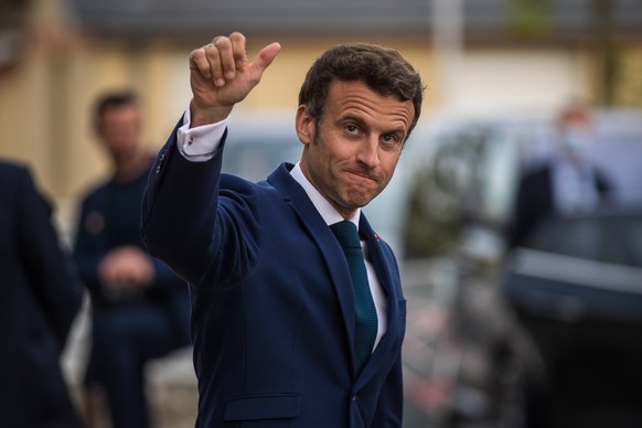 epa09914841 French President Emmanuel Macron waves as he leaves after his visit at the &#039;Percy&#039; Army Hospital in Clamart, near Paris, France, 28 April 2022. Macron met soldiers injured during ...