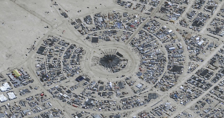 In this satellite photo provided by Maxar Technologies, an overview of Burning Man festival in Black Rock, Nev on Monday, Aug. 28, 2023. (�2023 Maxar Technologies via AP)