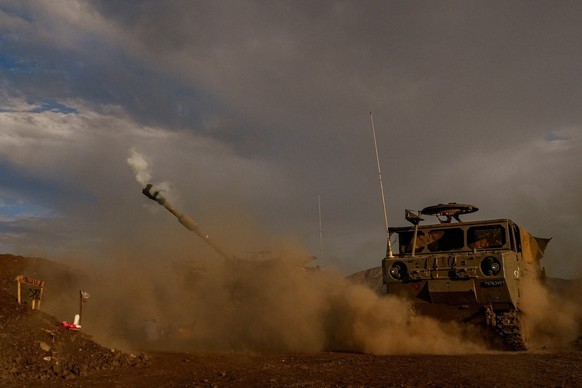 epa10955022 An Israeli artillery unit fires during a military drill in the annexed Golan Heights near the border with Lebanon, 02 November 2023. Tensions remain high at the border between Israel and L ...
