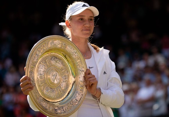Mandatory Credit: Photo by Ella Ling/Shutterstock 13018055as Elena Rybakina holds aloft the Rosewater Dish after victory in Ladies Singles Final Wimbledon Tennis Championships, Day 13, The All England ...