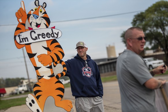 Travis Huffman participates in a strike against Kellogg Co. on Monday, Oct. 11, 2021 at the Kellogg plant on Porter Street in Battle Creek, Mich. Union workers walked out last Tuesday after Kellogg&#0 ...