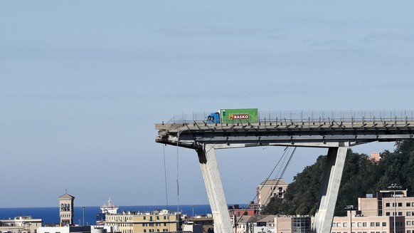 A view of the Morandi highway bridge that collapsed in Genoa, northern Italy, Wednesday, Aug. 15, 2018. A large section of the bridge collapsed over an industrial area in the Italian city of Genova du ...