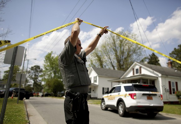 Law enforcement investigate the scene of a shooting, Wednesday, April 21, 2021 in Elizabeth City, N.C. At least one law enforcement officer with a sheriff&#039;s department in North Carolina shot and  ...