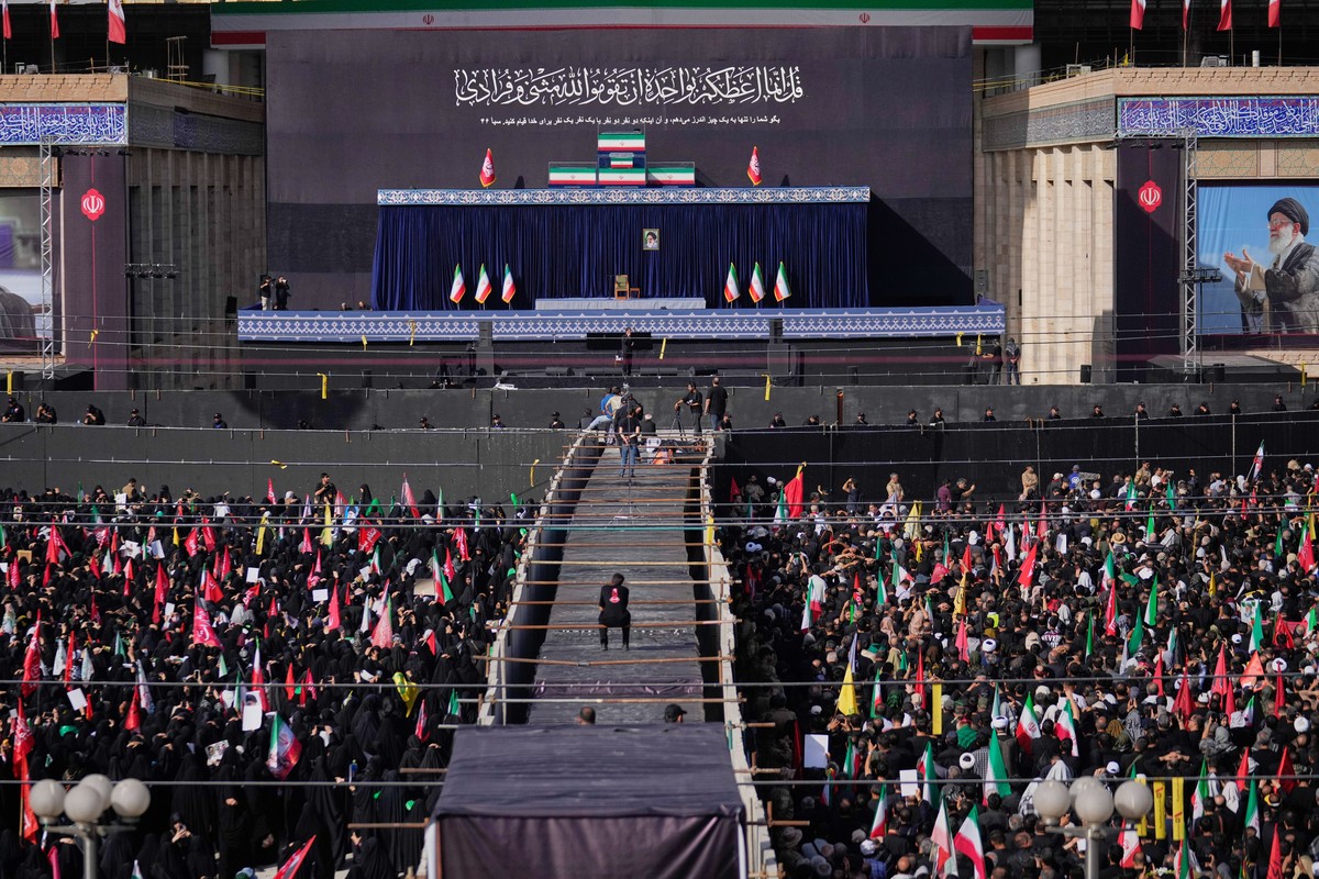 The coffins of slain Iranian Supreme Leader Ayatollah Ali Khamenei and members of his family are displayed on a stand at the start of the dayslong funeral ceremonies at the Imam Khomeini Mosalla Grand ...