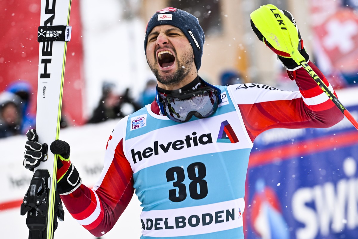 epa09675494 Winner Johannes Strolz of Austria celebrates on the podium for the Men's Slalom race at the FIS Alpine Skiing World Cup in Adelboden, Switzerland, 09 January 2022. EPA/JEAN-CHRISTOPHE ...