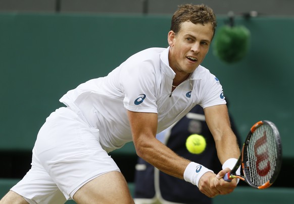 Vasek Pospisil of Canada returns a shot to Andy Murray of Britain during the men&#039;s quarterfinal singles match at the All England Lawn Tennis Championships in Wimbledon, London, Wednesday July 8,  ...