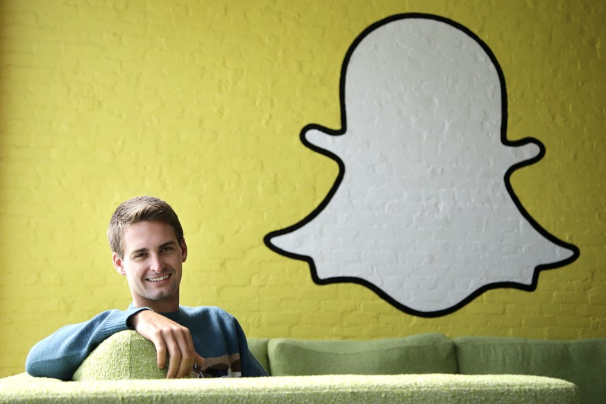 FILE - In this Thursday, Oct. 24, 2013, file photo, Snapchat CEO Evan Spiegel poses for a photo in Los Angeles. Tax-filing season is turning into a nightmare for thousands of employees working at comp ...