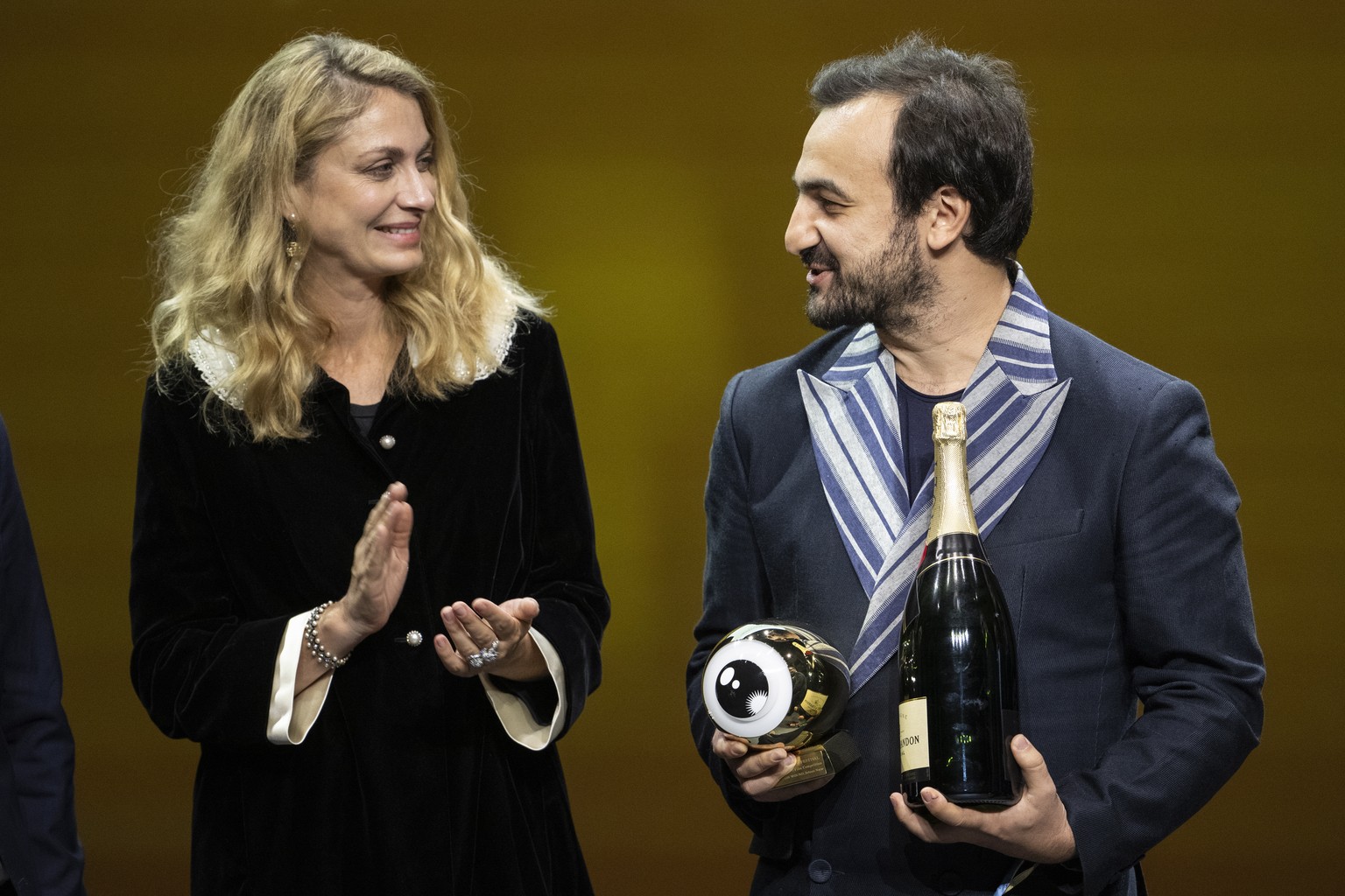 epa10906534 Teredduet Cizgisi (R) receives the Award for &#039;Hesitation wound&#039; during the Award Night ceremony of 19th Zurich Film Festival (ZFF) in Zurich, Switzerland, 07 October 2023. The fi ...