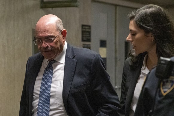 epa10310887 Allen Weisselberg (L), former US President Donald Trump&#039;s company chief financial officer, leaves the court after testifying in New York, New York, USA, 17 November 2022. The case mad ...