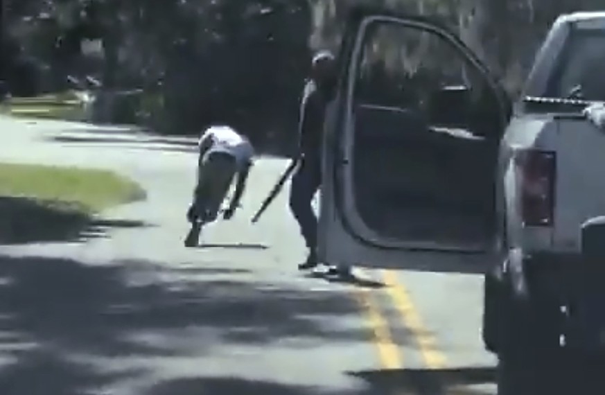 ADDS THAT THE AP HAS NOT BEEN ABLE TO VERIFY THE SOURCE OF THE VIDEO - This image from video posted on Twitter Tuesday, May 5, 2020, purports to show Ahmaud Arbery stumbling and falling to the ground  ...