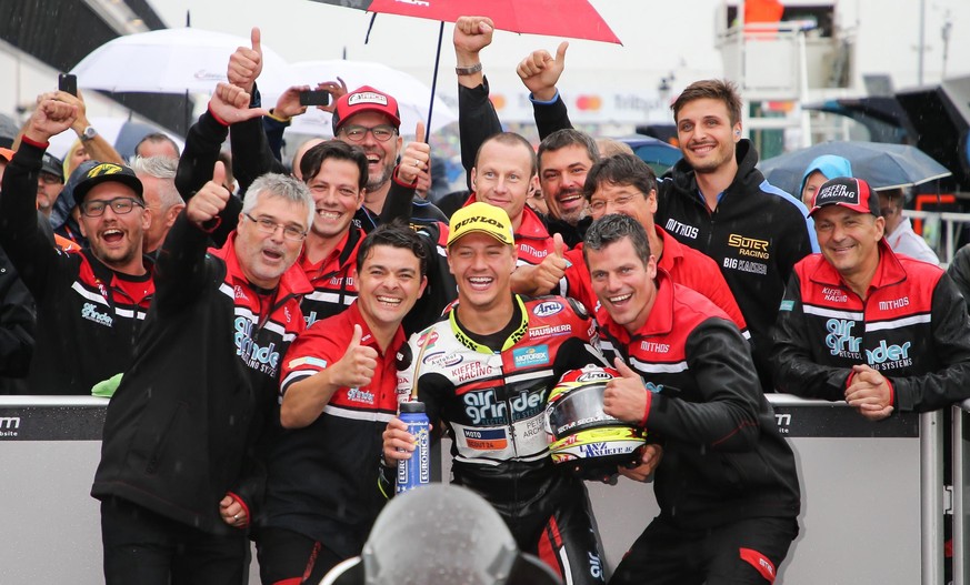 epa06196241 Swiss rider Dominique Aegerter of Kiefer Racing celebrates with teammates after winning the Moto2 Grand Prix of San Marino and Riviera of Rimini at Misano circuit, in Misano Adriatico, Ita ...