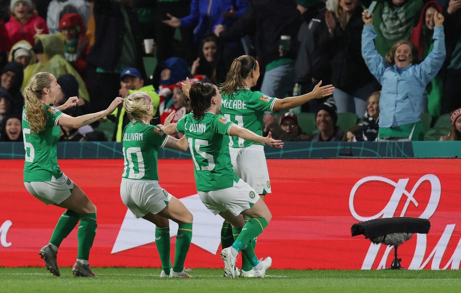 epa10769309 Katie McCabe (R) of Ireland celebrates with teammates and fans after scoring the 0-1 opening goal during the FIFA Women&#039;s World Cup group B match between Canada and Ireland in Perth,  ...