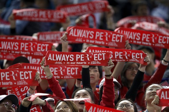 Fans of Roger Federer of Switzerland wave banners during the men&#039;s singles match between Federer and Daniil Medvedev of Russia in the Shanghai Masters tennis tournament at Qizhong Forest Sports C ...