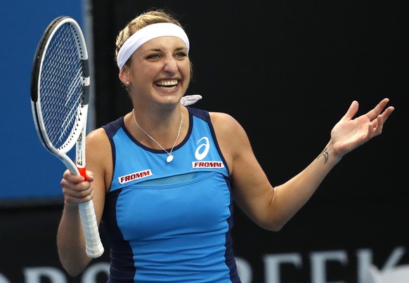 Switzerland&#039;s Timea Bacsinszky celebrates after defeating Italy&#039;s Camila Giorgi during their first round match at the Australian Open tennis championships in Melbourne, Australia, Tuesday, J ...