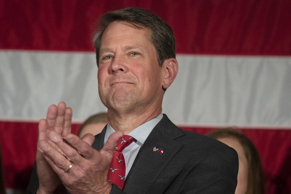 FILE - In this July 26, 2018, file photo, Georgia Secretary of State Brian Kemp appears during a unity rally, in Peachtree Corners, Ga. Former state Rep. Stacey Abrams has accused Kemp of suppressing  ...