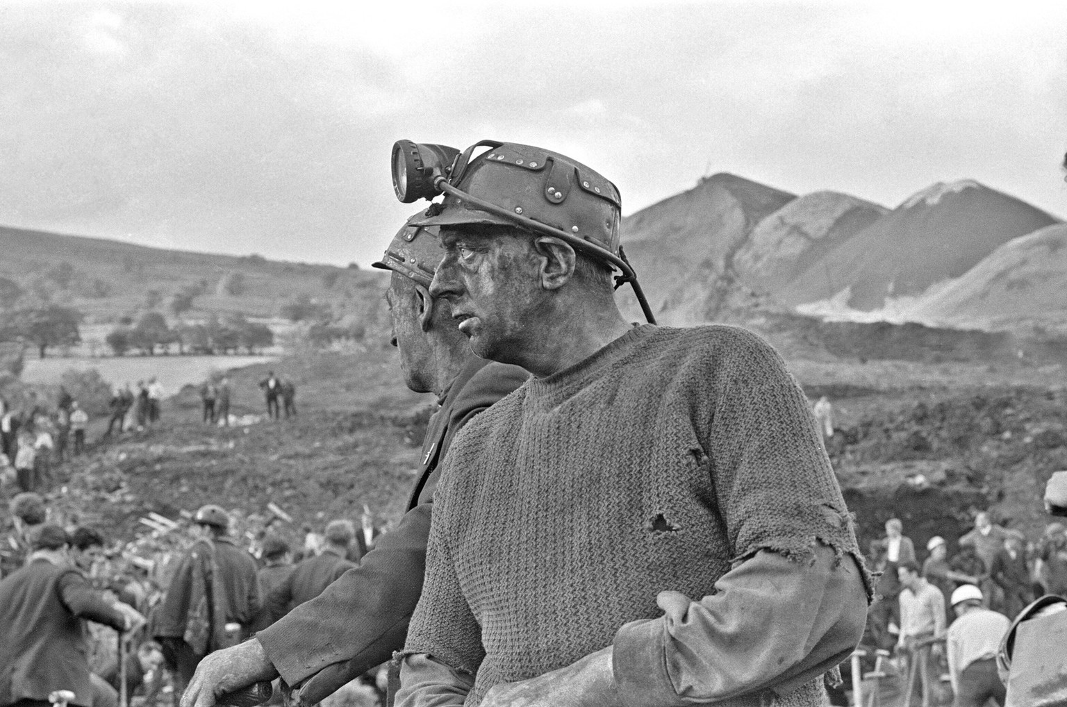 Rescue workers take a break from searching following the catastrophic collapse of a colliery spoil tip in the Welsh village of Aberfan, near Merthyr Tydfil, on 21 October 1966. (Photo by Ron Burton/Mi ...