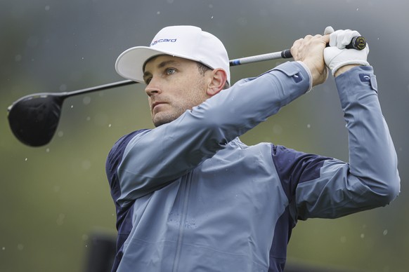 Joel Girrbach from Switzerland watches his tee shot during the first round of the European Masters Golf Tournament, in Crans-Montana, Switzerland, Thursday, Sept. 5, 2024. (Valentin Flauraud/Keystone  ...