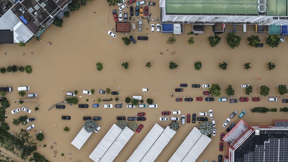 epa12539383 An aerial photo taken with a drone shows a flooded area in Nha Trang, Khanh Hoa province, southern Vietnam, 20 November 2025 (issued on 21 November 2025). At least 40 people were killed af ...