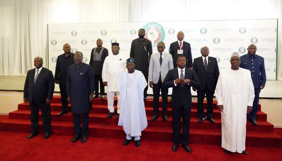 Nigeria&#039;s President, Bola Ahmed Tinubu, center first row, poses for a group photo with other West African leaders before an ECOWAS meeting in Abuja, Nigeria. Thursday, Aug. 10, 2023. West African ...