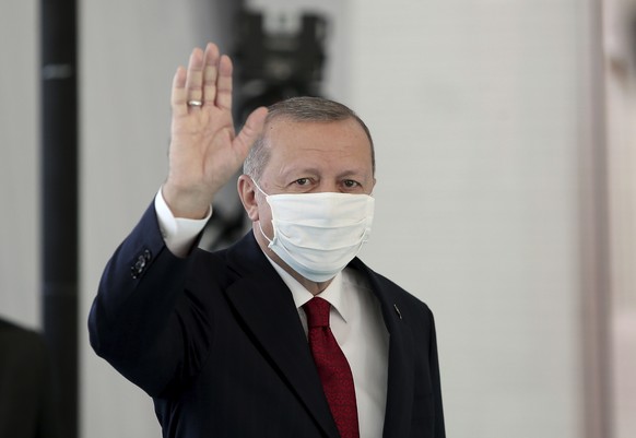 Turkey&#039;s President Recep Tayyip Erdogan, wearing a mask for protection against the coronavirus, arrives to inaugurate a new hospital in Istanbul, Friday, May 29, 2020. Worshippers in Turkey have  ...