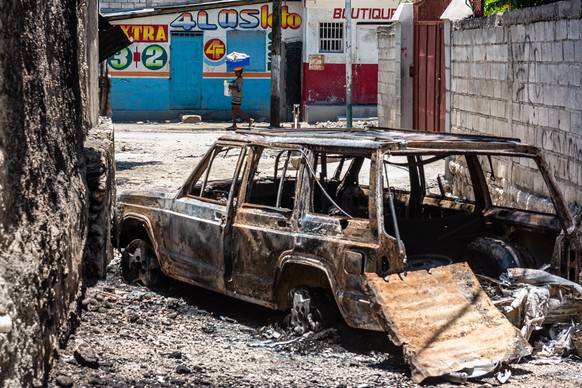 epa09930766 A vehicle incinerated by criminal gang in the commune of Tabarre, in Port-au-Prince, Haiti 06 May 2022. The United Nations estimated on 06 May at 75 civilians killed in the last two weeks  ...
